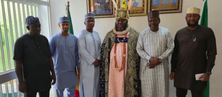 Group photograph of His Royal Highness, Asari Dokubo, with Embassy officials during the courtesy visit.